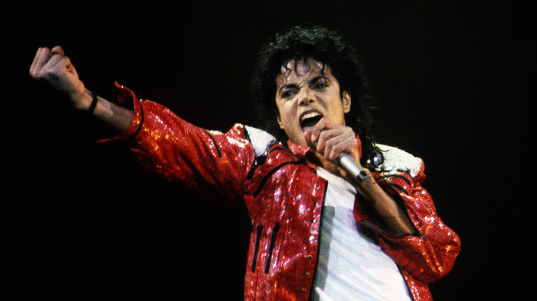 Michael Jackson singing in microphone