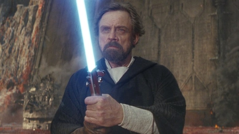 Luke Skywalker holding lightsaber