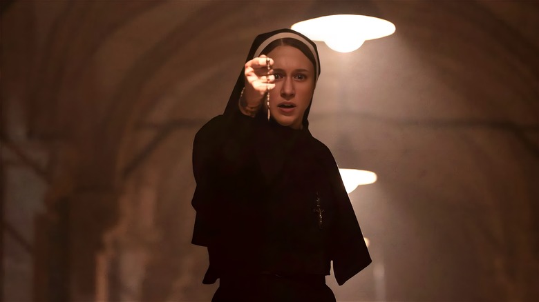 The Nun holding prayer bead